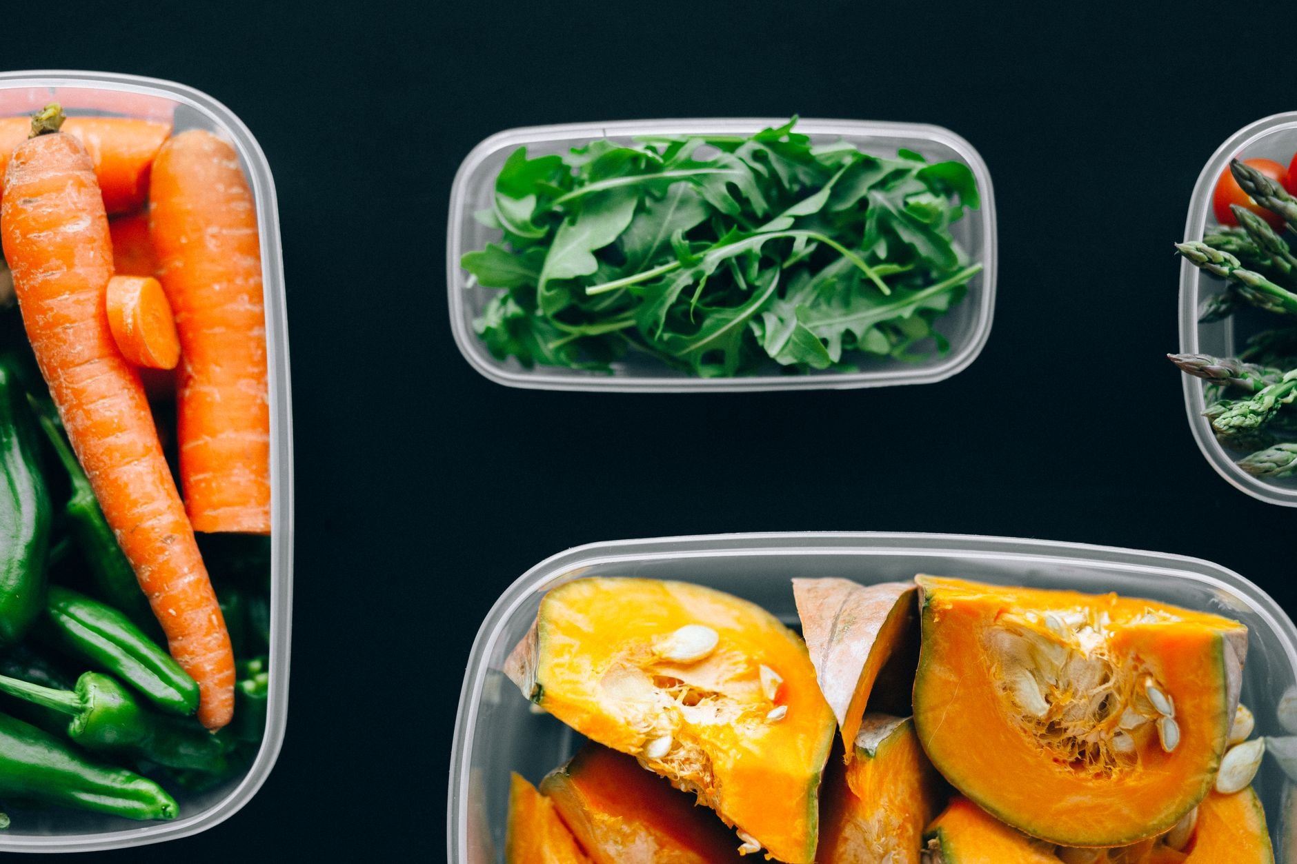 Healthy vegetables stored in containers for nutritious meal planning.